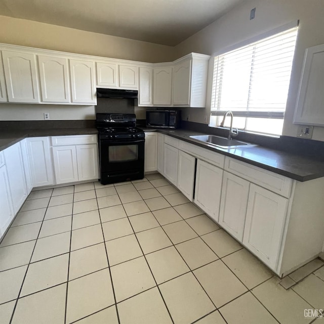 kitchen with light tile patterned flooring, sink, white cabinets, and black appliances