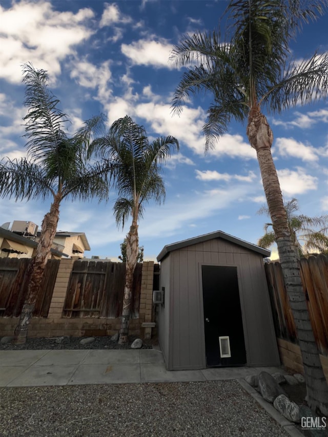 view of shed with a fenced backyard