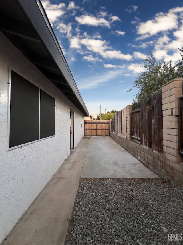 fenced backyard with a patio