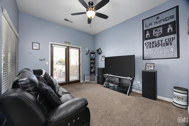 living room featuring ceiling fan and carpet floors