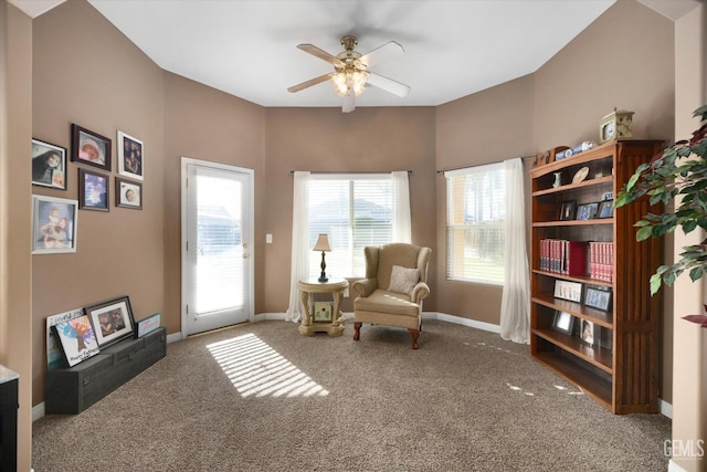 sitting room featuring ceiling fan and carpet floors