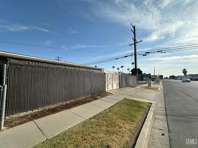 1022 9th Ave, Delano, CA 93215 - view of asphalt road featuring sidewalks and curbs