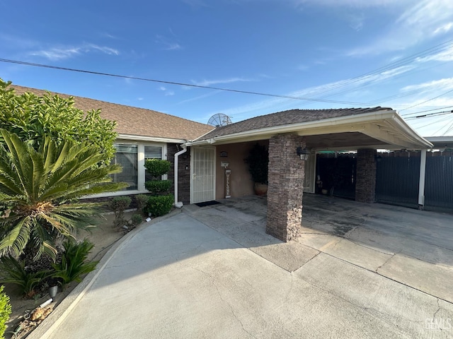 1022 9th Ave, Delano, CA 93215 - view of front of property featuring concrete driveway and roof with shingles