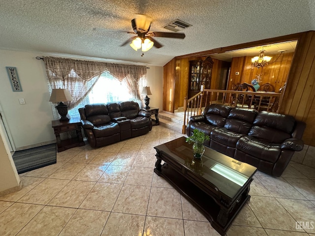 1022 9th Ave, Delano, CA 93215 - living area with a chandelier, a textured ceiling, tile patterned floors, ceiling fan, and wood walls