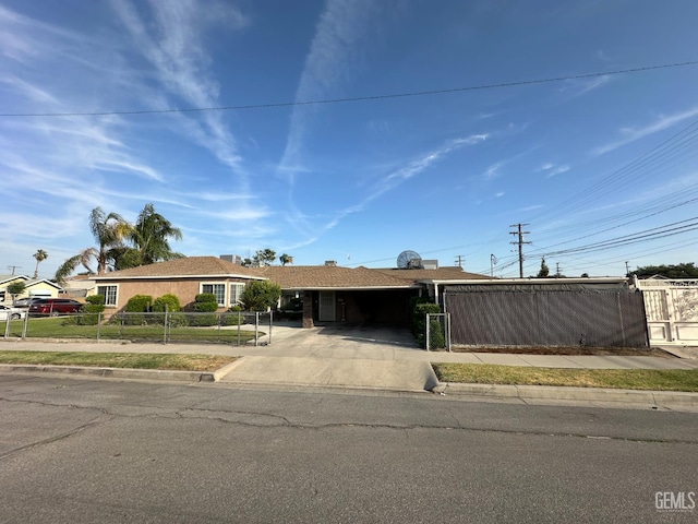 1022 9th Ave, Delano, CA 93215 - single story home with a fenced front yard and concrete driveway