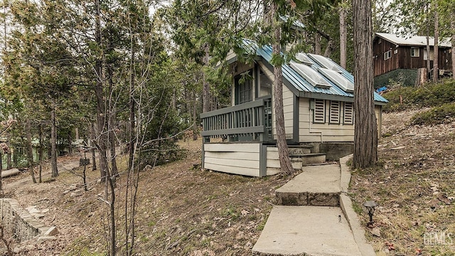 view of home's exterior with metal roof