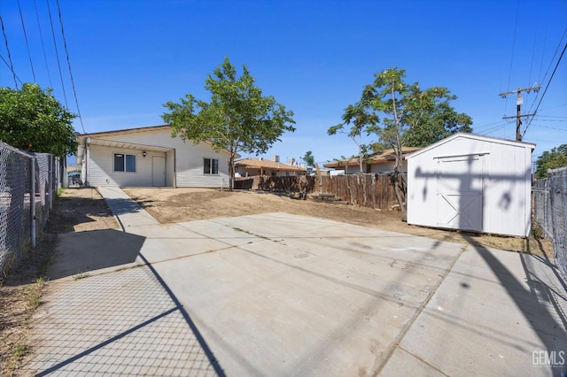 132 E Center St, Taft, CA 93268 - fenced backyard featuring a storage shed and a patio area