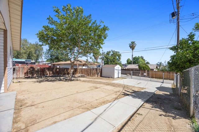 132 E Center St, Taft, CA 93268 - fenced backyard with a storage unit and a patio area