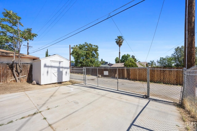 132 E Center St, Taft, CA 93268 - view of patio with a gate and a shed