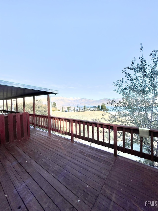 wooden terrace featuring a mountain view