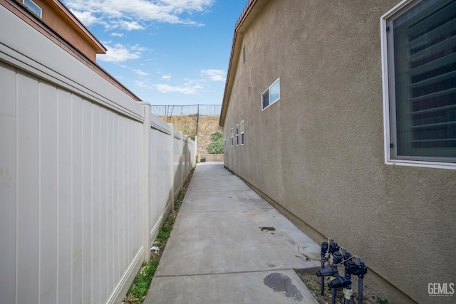 18019 Lapis Ln, San Bernardino, CA 92407 - view of home's exterior with a patio and stucco siding
