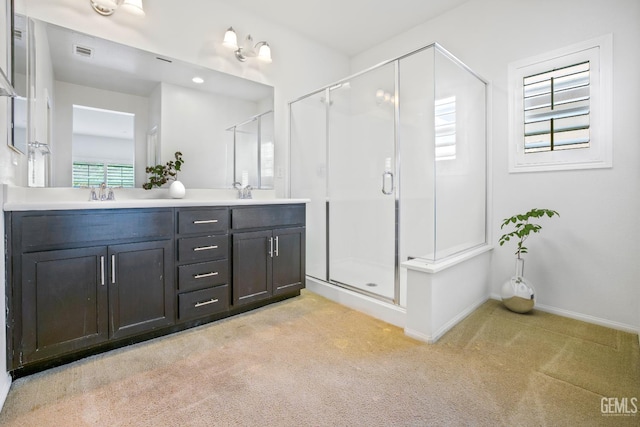 18019 Lapis Ln, San Bernardino, CA 92407 - bathroom featuring a stall shower, double vanity, and carpet flooring