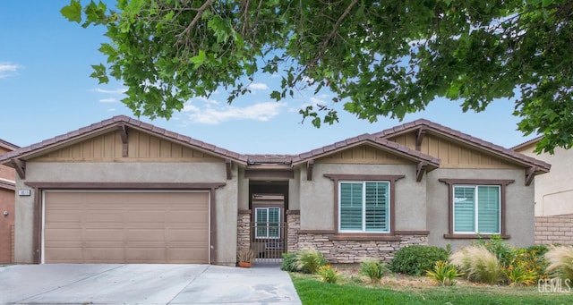 18019 Lapis Ln, San Bernardino, CA 92407 - view of front of home with stone siding, driveway, a garage, stucco siding, and board and batten siding