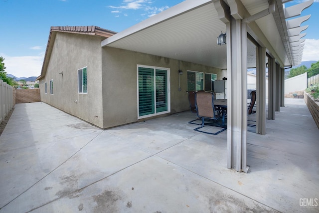 18019 Lapis Ln, San Bernardino, CA 92407 - fenced backyard with a patio area and outdoor dining area