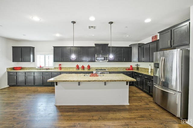18019 Lapis Ln, San Bernardino, CA 92407 - kitchen featuring stainless steel appliances, a kitchen island, light stone countertops, hanging light fixtures, and recessed lighting