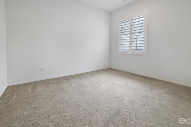 18019 Lapis Ln, San Bernardino, CA 92407 - carpeted empty room featuring baseboards