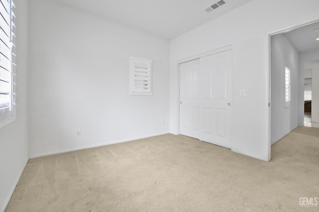 18019 Lapis Ln, San Bernardino, CA 92407 - unfurnished bedroom featuring carpet flooring and a closet
