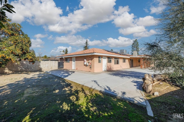 back of house featuring a patio area