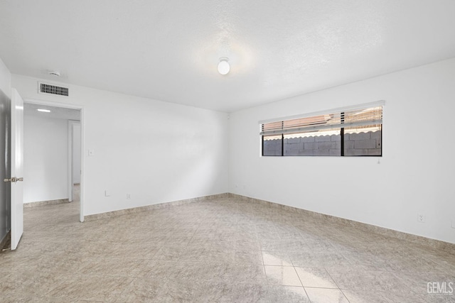 spare room with light tile patterned floors