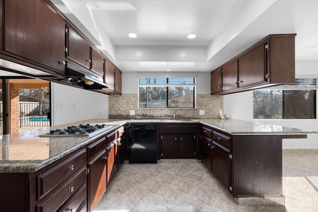 kitchen featuring dishwasher, dark brown cabinets, kitchen peninsula, and stainless steel gas cooktop