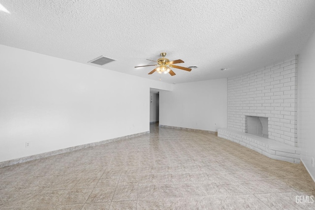 unfurnished living room featuring a textured ceiling, ceiling fan, and a fireplace