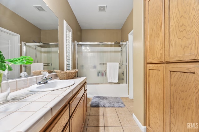 2109 Via Tuscania Ave, Delano, CA 93215 - bathroom with vanity, tile patterned floors, and combined bath / shower with glass door