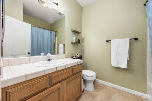 2109 Via Tuscania Ave, Delano, CA 93215 - full bath featuring vanity, toilet, baseboards, and tile patterned floors