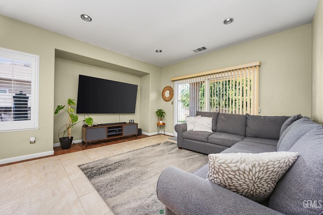 2109 Via Tuscania Ave, Delano, CA 93215 - living room featuring baseboards, tile patterned flooring, and recessed lighting