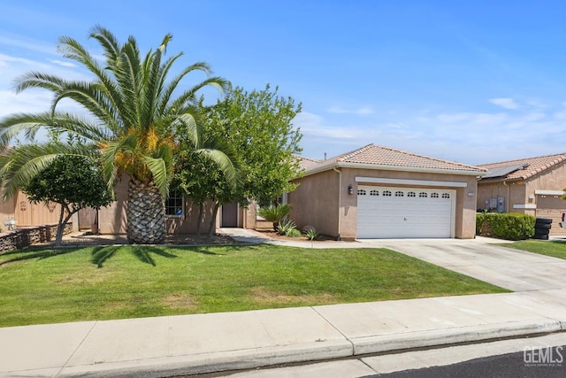 2109 Via Tuscania Ave, Delano, CA 93215 - view of front of house with an attached garage, stucco siding, driveway, and a front lawn