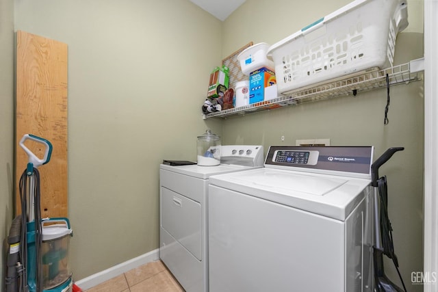 2109 Via Tuscania Ave, Delano, CA 93215 - washroom featuring washer and clothes dryer, light tile patterned floors, and baseboards