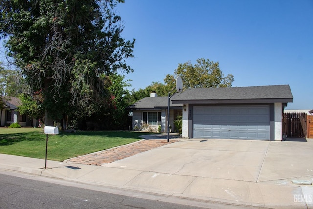 view of front of house with a front yard and a garage