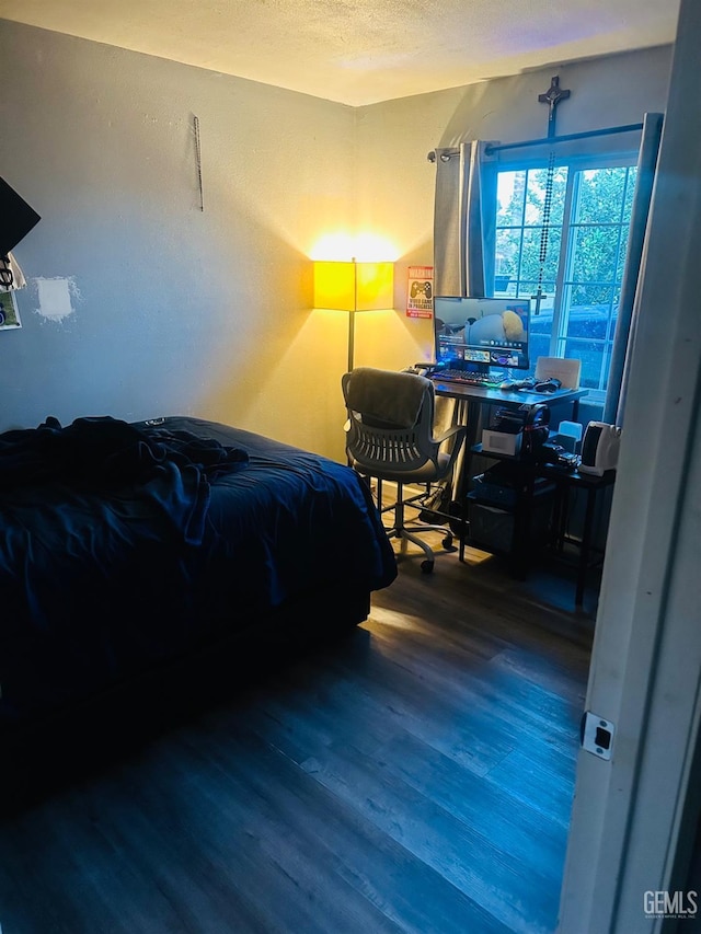 bedroom featuring hardwood / wood-style floors