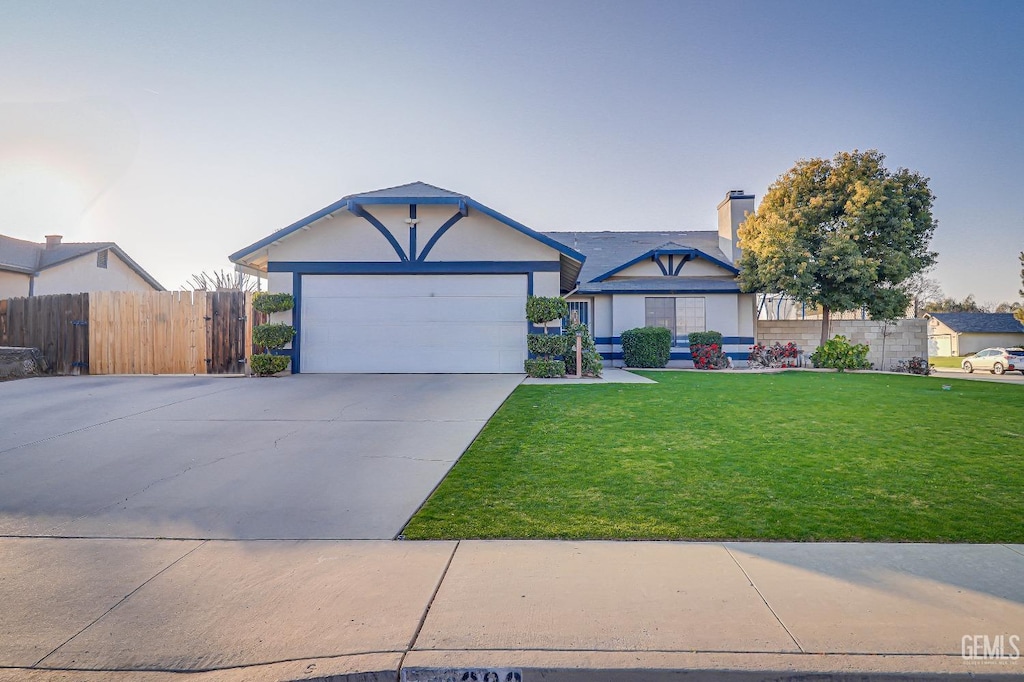 view of front facade with a garage and a front yard