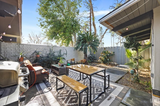 view of patio / terrace featuring an outdoor living space and grilling area