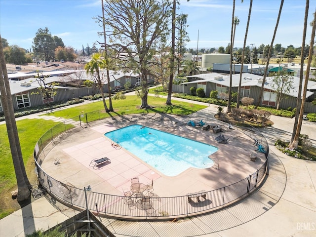 view of pool with a yard and a patio