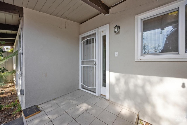 doorway to property with a patio