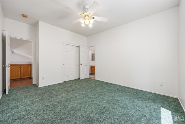 3625 Bernard St Unit 5, Bakersfield, CA 93306 - unfurnished bedroom with dark carpet, a closet, baseboards, and a ceiling fan