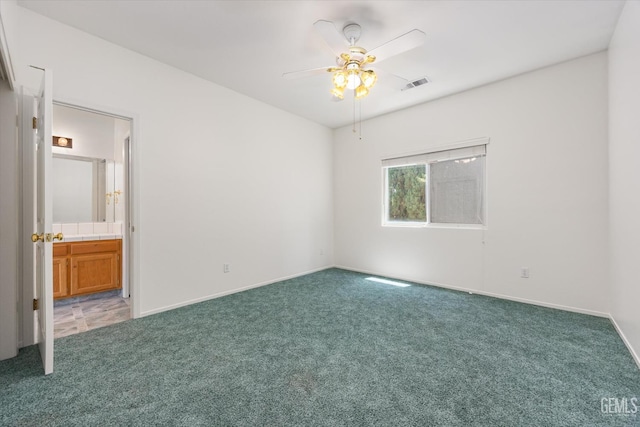 3625 Bernard St Unit 5, Bakersfield, CA 93306 - unfurnished bedroom featuring light colored carpet, baseboards, ensuite bathroom, and ceiling fan