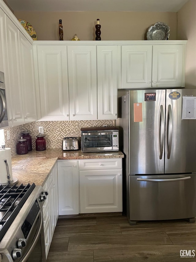 10011 Rosebud Ave, Bakersfield, CA 93311 - kitchen with appliances with stainless steel finishes, white cabinets, backsplash, and dark wood-type flooring