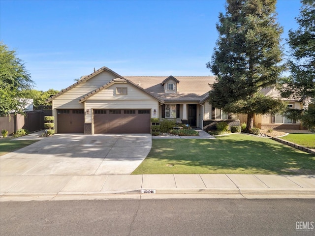 11313 Valletta Ave, Bakersfield, CA 93312 - view of front of property with an attached garage, driveway, a front lawn, and a tiled roof