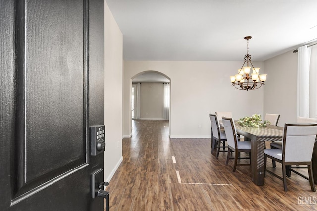 11313 Valletta Ave, Bakersfield, CA 93312 - dining area featuring arched walkways, wood finished floors, and a chandelier