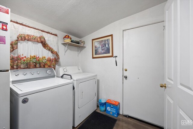 220 Tyler St, Taft, CA 93268 - laundry room featuring washing machine and clothes dryer, a textured ceiling, and dark wood finished floors