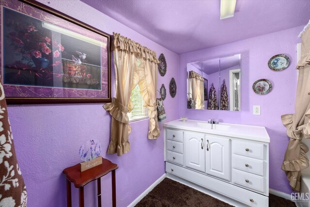 220 Tyler St, Taft, CA 93268 - bathroom with vanity and baseboards
