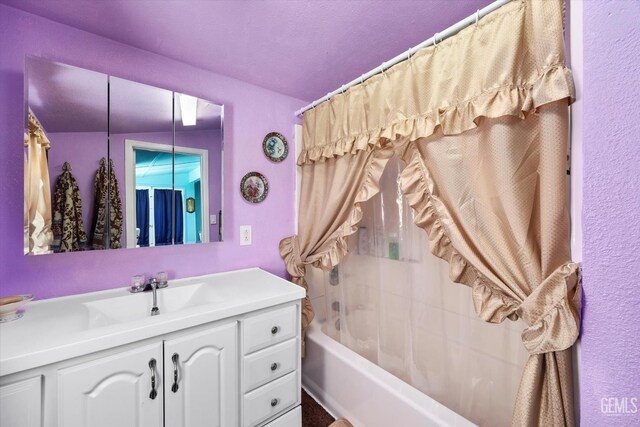 220 Tyler St, Taft, CA 93268 - full bathroom featuring vanity and shower / bathtub combination with curtain