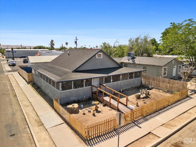 220 Tyler St, Taft, CA 93268 - rear view of house featuring a sunroom and a fenced backyard