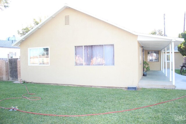 view of home's exterior featuring a lawn