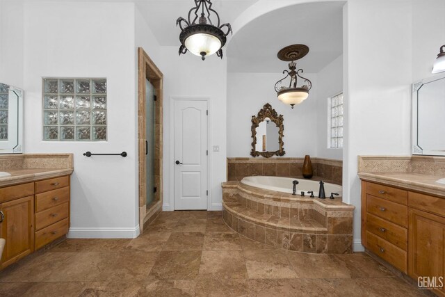 10834 Olcese Rd, Bakersfield, CA 93308 - bathroom featuring vanity and independent shower and bath