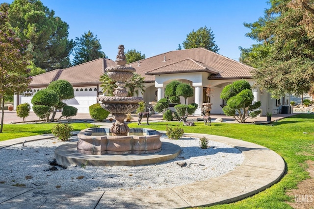 10834 Olcese Rd, Bakersfield, CA 93308 - mediterranean / spanish house with central air condition unit, a front lawn, and a garage