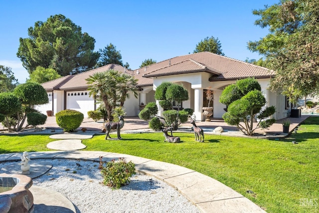 10834 Olcese Rd, Bakersfield, CA 93308 - mediterranean / spanish-style home featuring a garage and a front yard