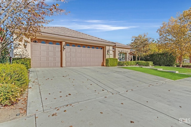 single story home featuring a front yard and a garage